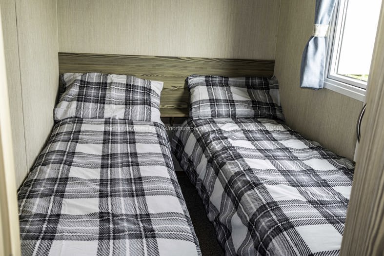 One of two twin bedrooms
