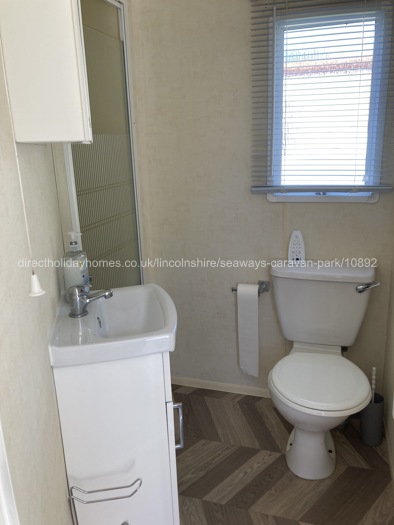 Bathroom with shower and towel radi