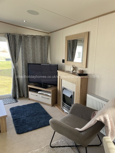 Lounge area with electric fire.
