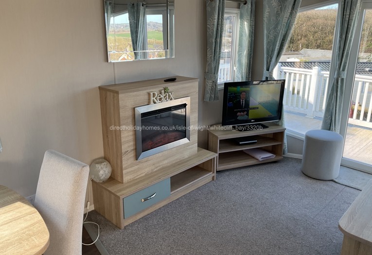 Lounge area with wall fire.