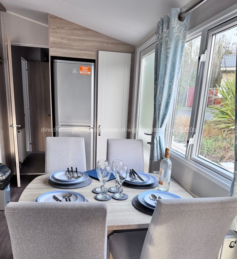 Dining area with door to bedrooms a