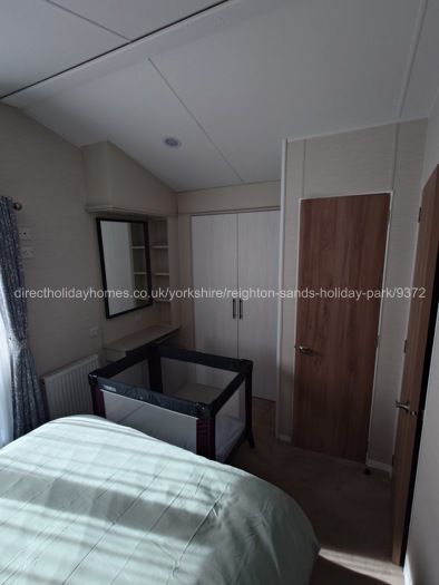 Master bed showing cot bed
