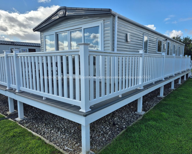 Caravan with wrap around decking