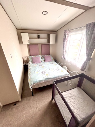 Cot bed and highchair available  