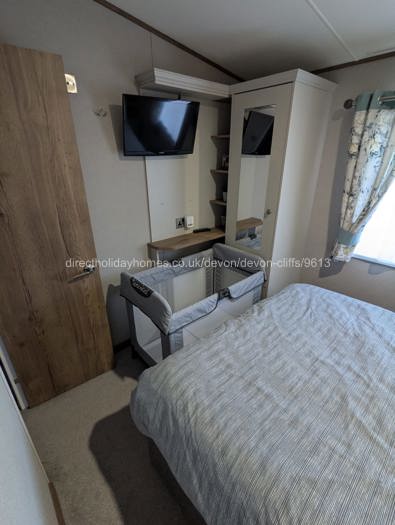 Double bed with travel cot set up
