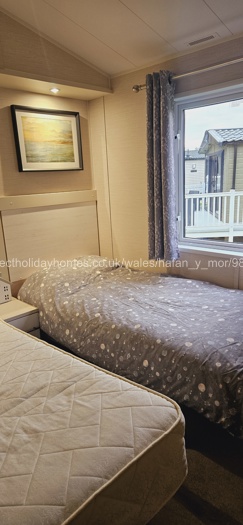 2 large single beds with TV 